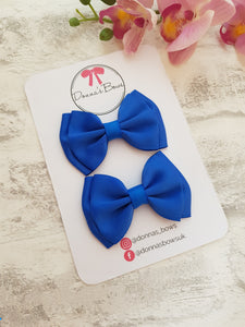 Royal blue ribbon pigtail bows